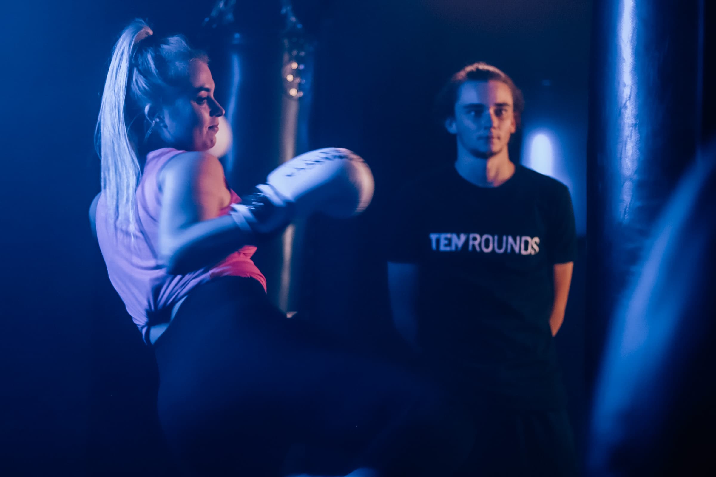 Coach guiding a member through a boxing combination at TENROUNDS Garsfontein