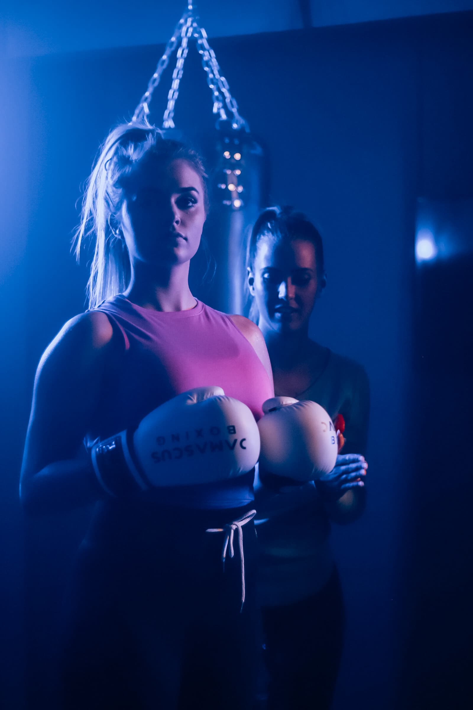 Two female members with white boxing gloves at TENROUNDS Garsfontein