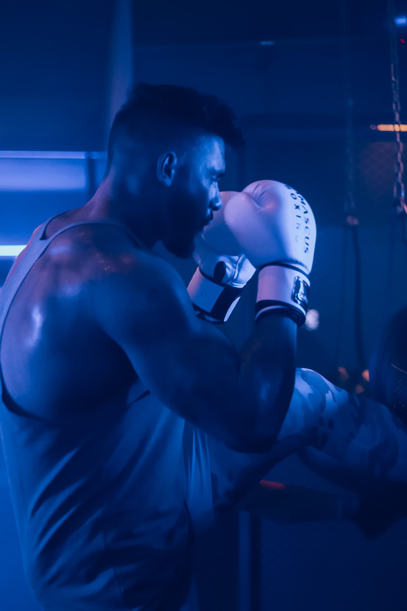 Male member training at a boxing heavy bag at TENROUNDS Pretoria East