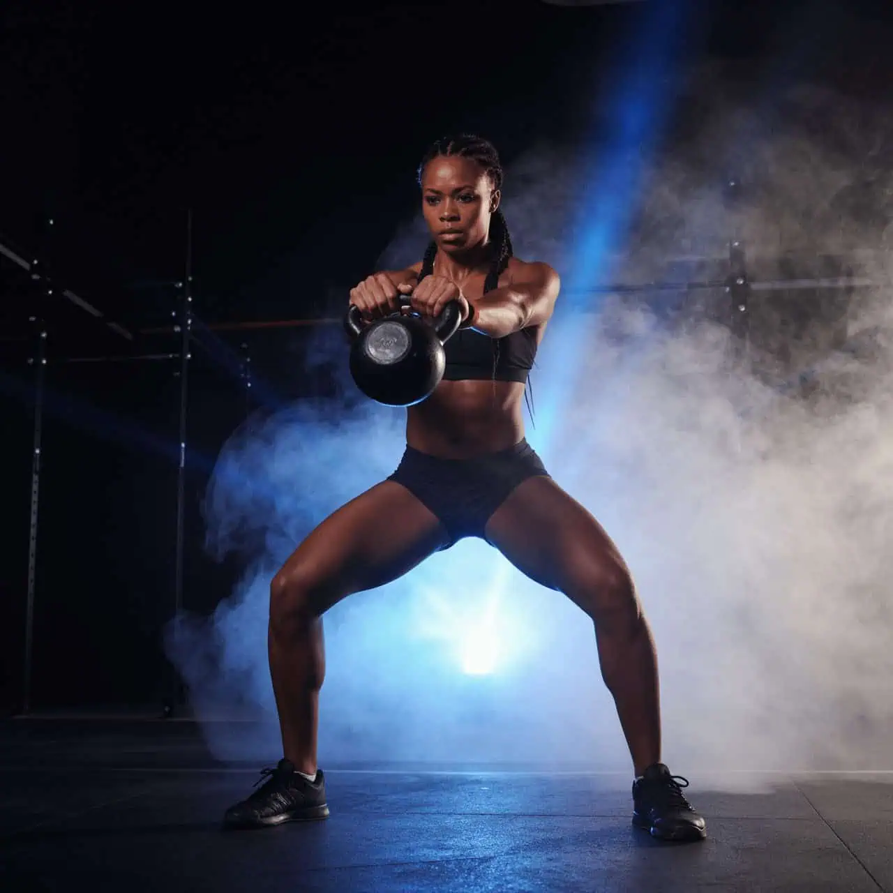 Athlete performing a kettlebell squat